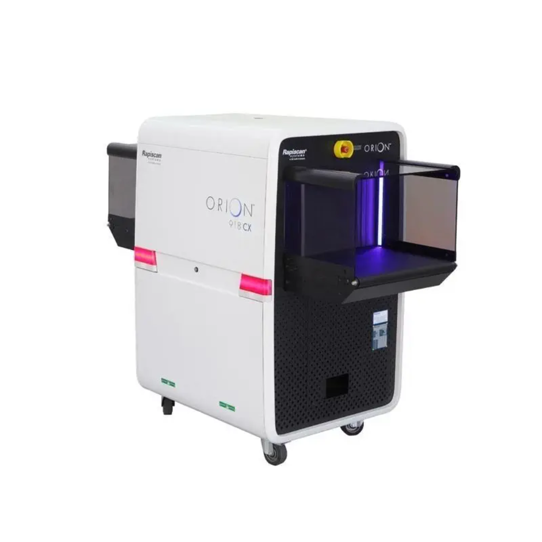 918cx (1) ORION 918CX, Rapiscan ORION 918CX, ORION 918CX X-Ray Scanner, ORION 918CX Baggage Scanner, 918CX X-Ray Machine, Baggage X-Ray Scanner, Airport Security X-Ray Machine, Security Screening System, Carry-On Baggage Scanner, Parcel Inspection System, Cabin Baggage X-Ray Scanner, Checkpoint X-Ray Scanner, High Performance X-Ray Scanner, Compact X-Ray Scanner, Conveyor X-Ray Scanner, Security Inspection Equipment, X-Ray Baggage Inspection System, Parcel Screening Equipment, Mail Screening X-Ray System, Small Parcel X-Ray Scanner, Security X-Ray Machine, Dual Energy X-Ray Scanner, Material Discrimination X-Ray, Organic Material Detection, Inorganic Material Detection, Spectrum 4 Color Imaging, SP4 Imaging Technology, Dual Mode Z Effective, Z Effective Imaging, Explosives Detection System, Narcotics Detection System, Target Detection Software, NARCScan Technology, Automatic Threat Detection, Threat Image Projection, Image Enhancement Software, Low Density Image Enhancement, High Resolution X-Ray Imaging, Best Resolution X-Ray Scanner, Security Imaging System, Operator Assist X-Ray System, ScanOS Software, 64 Bit Windows X-Ray System, Aviation Security Scanner, Airport Checkpoint Scanner, Border Security X-Ray System, Customs Inspection Equipment, Critical Infrastructure Security, Government Security Screening, Law Enforcement Screening Equipment, Military Security Scanner, Port Security X-Ray Machine, Courier Screening System, Logistics Security Scanner, Warehouse Security Screening, Corporate Security X-Ray Machine, Building Entrance X-Ray Scanner, Event Security X-Ray Scanner, Prison Security Scanner, Court Security X-Ray System, Embassy Security Equipment, Remote Viewing X-Ray System, Networked X-Ray Scanner, Matrixing X-Ray System, Image Archiving X-Ray Scanner, Security Screening Technology, Advanced Threat Detection X-Ray, High Throughput X-Ray Scanner, Compact Baggage Inspection System, Security Checkpoint Equipment, Tunnel Size 540 x 360 mm, 540 x 360mm X-Ray Scanner, EC Aviation Compliant X-Ray System, X-Ray Machine for Airports, Parcel and Baggage Inspection, Professional X-Ray Inspection System, Security Screening Solutions, Rapiscan Security Equipment, ORION X-Ray Series, Baggage Inspection Equipment, X-Ray Scanner Manufacturer. The ORION 918CX features a 540 × 360 mm tunnel, Spectrum 4-Color Imaging, Dual Mode Z-effective material discrimination, explosives and narcotics detection, networking, remote viewing, and high-resolution image processing for checkpoint baggage inspection.